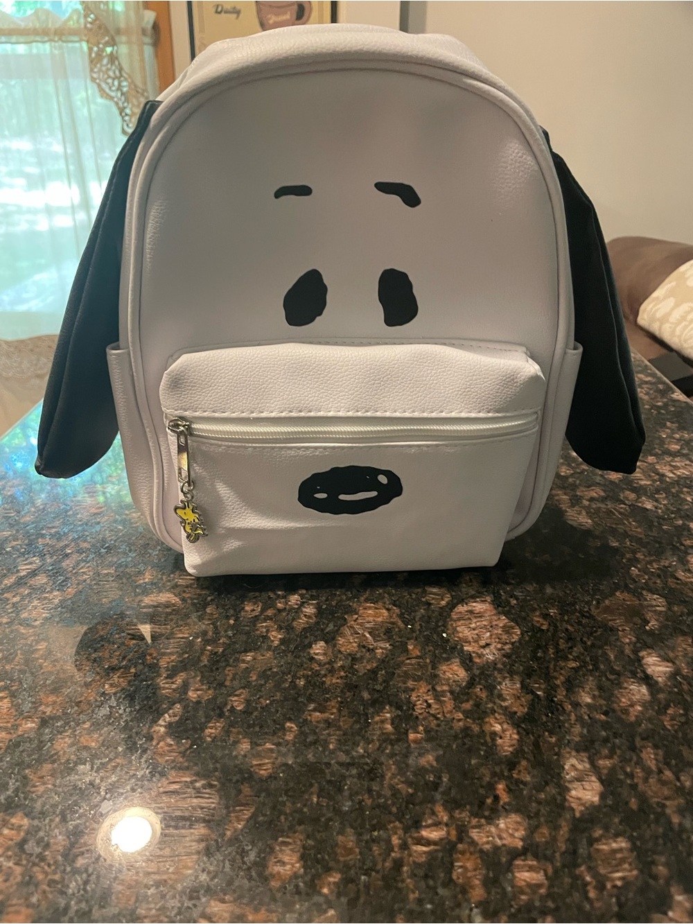 Peanuts Snoopy backpack with 3D ears and Woodstock zipper.